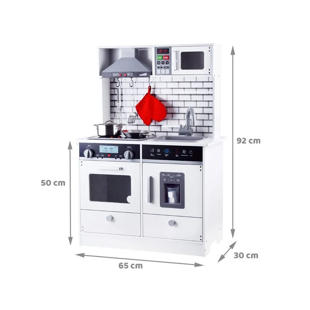 zestaw kuchenny z akcesoriami ustawiony w pokoju dziecięcym