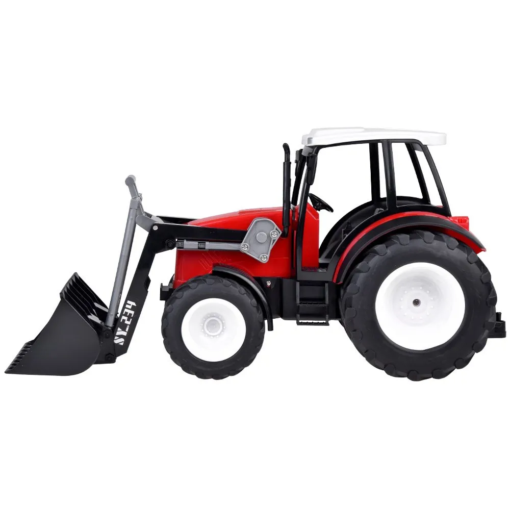 czerwony traktor z ruchomym ramieniem podczas zabawy