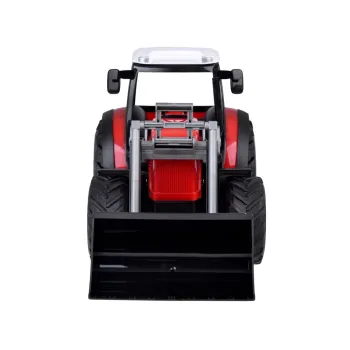 traktor na dywanie z podniesioną łyżką spychacza