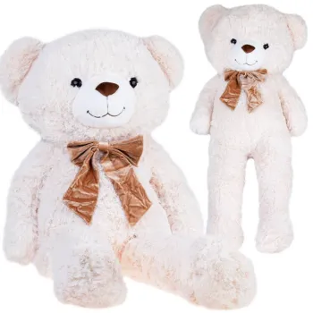 Duży miś pluszowy BEN 110 cm w jasnym kolorze na tle białej ściany