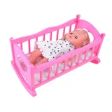 Łóżeczko z motywem gwiazdek i księżyca oraz elementami ozdobnymi