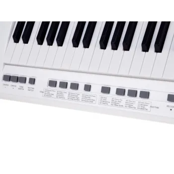 elektryczne pianino dziecięce prezentowane na białym tle