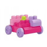 Dziecko układa kolorową wieżę z dużych klocków