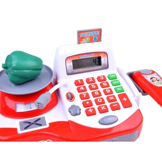dziecko bawiące się kasą fiskalną i skanerem