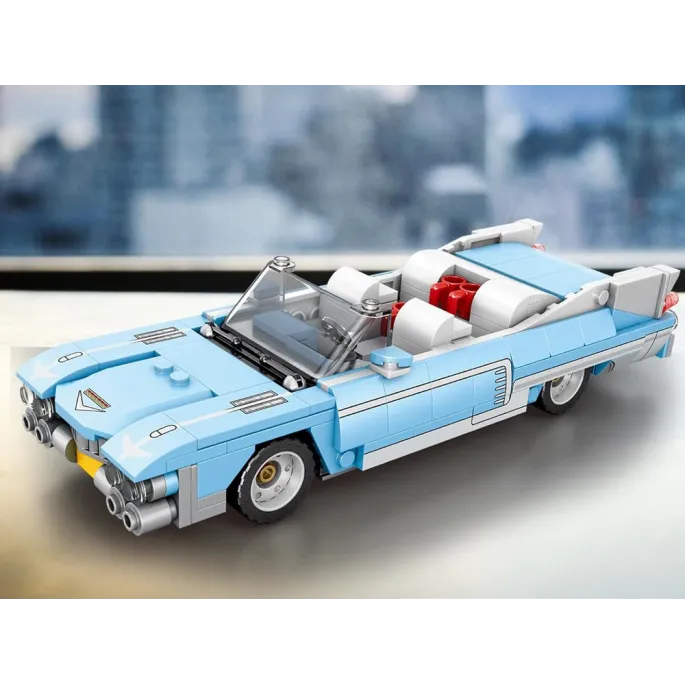 Błękitny kabriolet z szerokim grillem i klasycznymi detalami