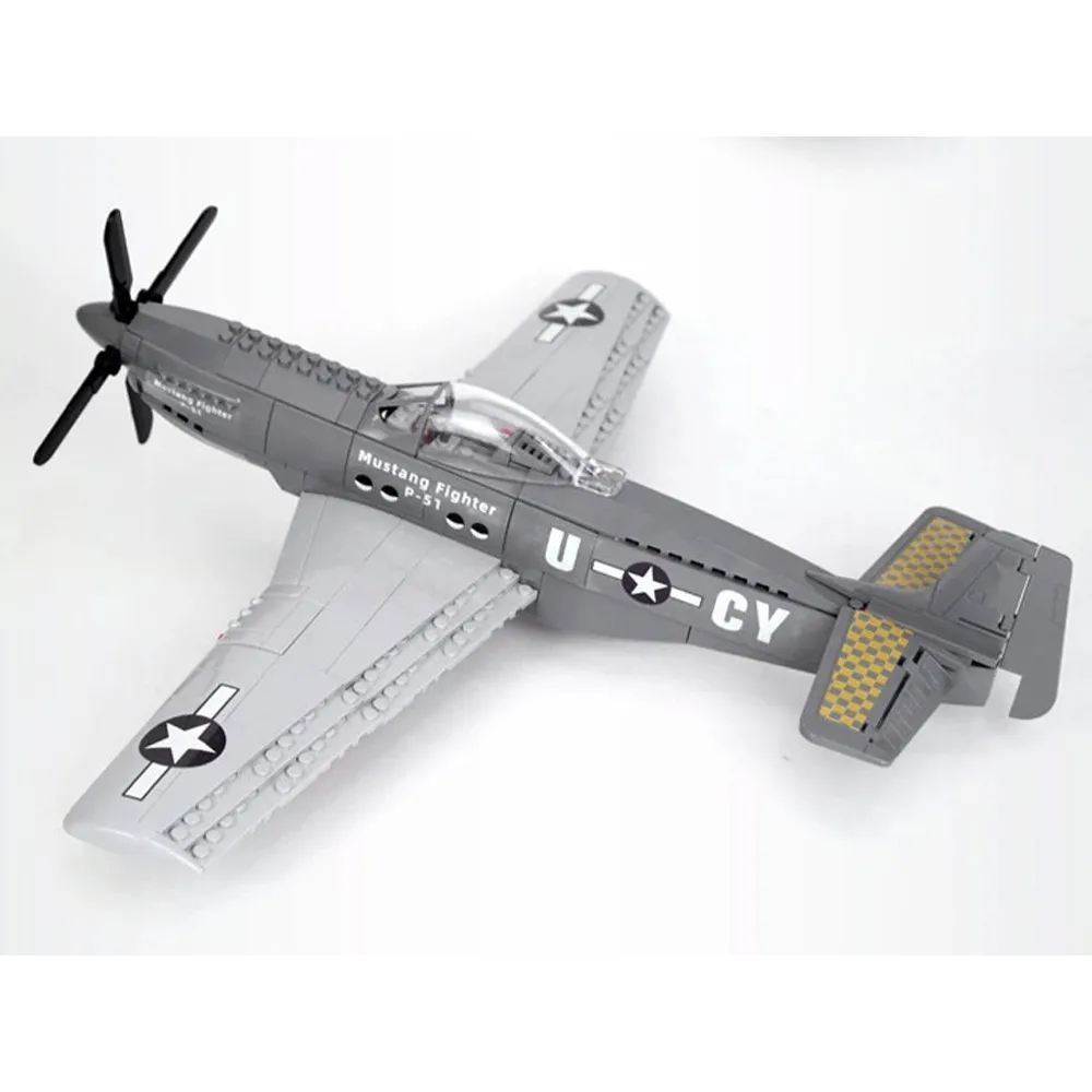 Elementy zestawu klocków przed złożeniem w model samolotu