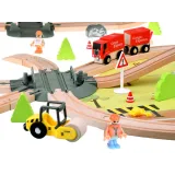 ciężarówka z kontenerem obok torów kolejowych dla dzieci