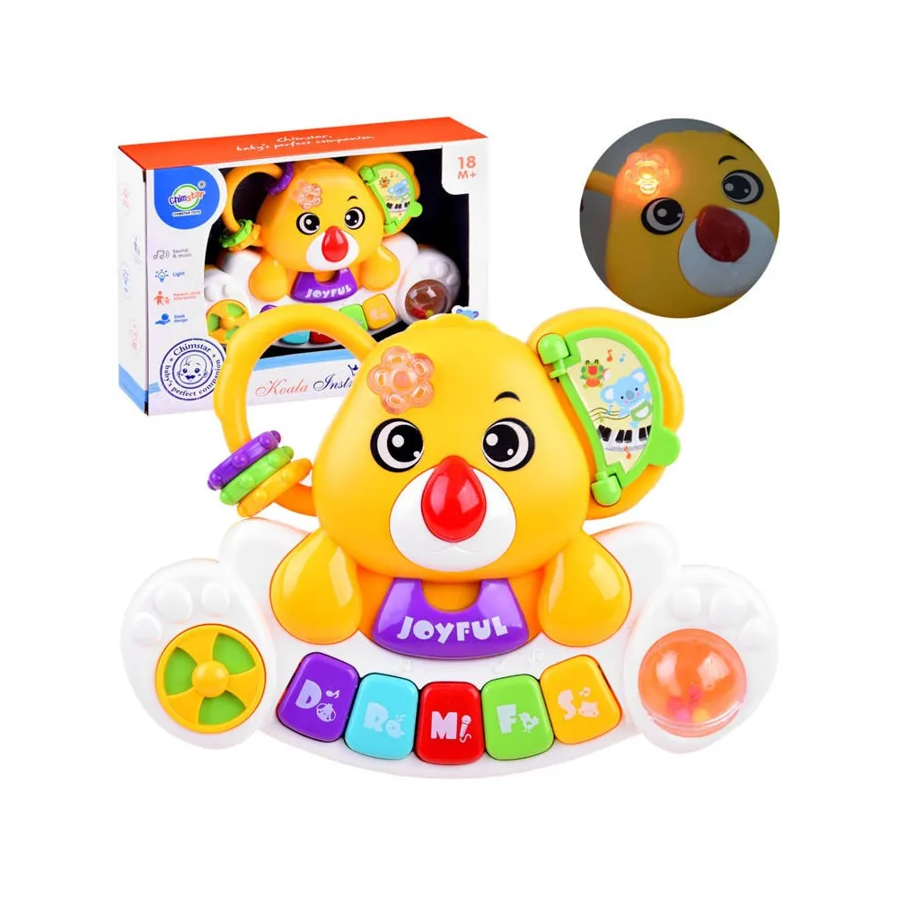 kolorowe pianinko organki z motywem misia koala na białym tle