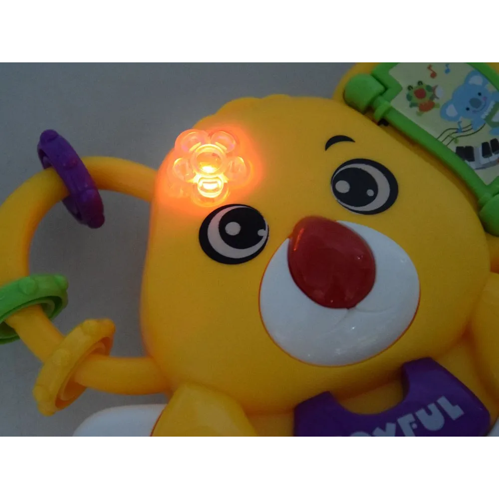 misio koala z zabawną minką jako element dekoracyjny pianinka