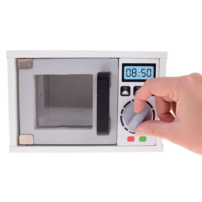 dziecko bawiące się kuchenką i akcesoriami imitującymi posiłki