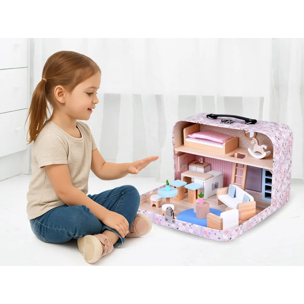 Przenośny domek dla lalek rozłożony do zabawy na stole