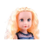 Lalka z długimi blond włosami i szczotką do czesania