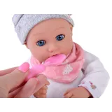 Zestaw do karmienia obok ułożonej lalki bobasa