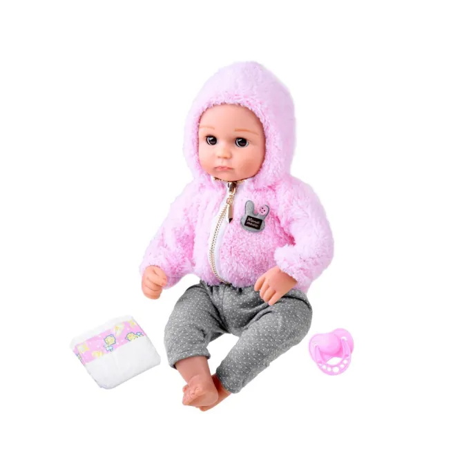 Lalka bobas w pozycji siedzącej na miękkim materiale