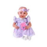 Lalka bobas w liliowej sukience oraz białych skarpetkach i spodeneczkach