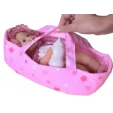 lalka bobas w ubranku w króliczki siedząca w nosidełku