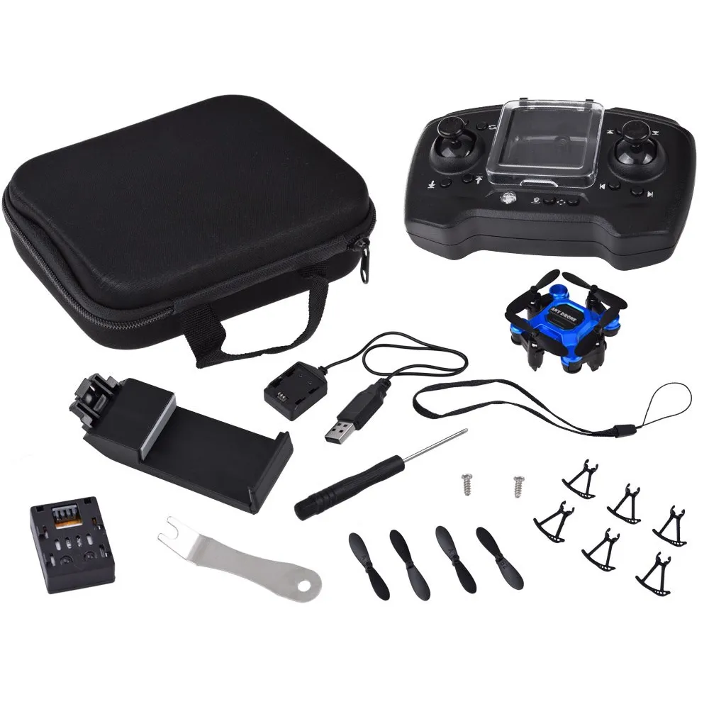 mini dron rc0656 w trybie lotu na tle zieleni