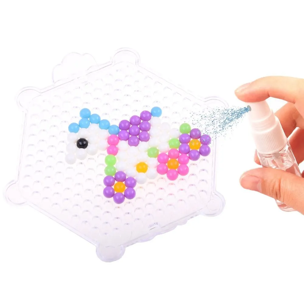 łączenie koralików wodą na podstawce przy pomocy aplikatora