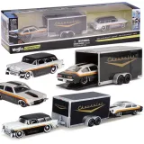 dwa metalowe modele chevroleta nomad 1955 i vega 1971 w skali 1:64 na białym tle
