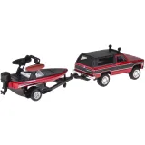 Odczepiana łódź umieszczona na przyczepie obok samochodu terenowego