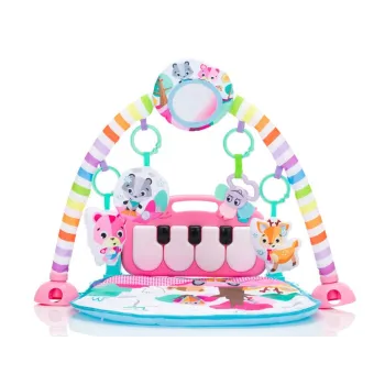 maluch leżący na macie, bawiący się zawieszkami na łuku