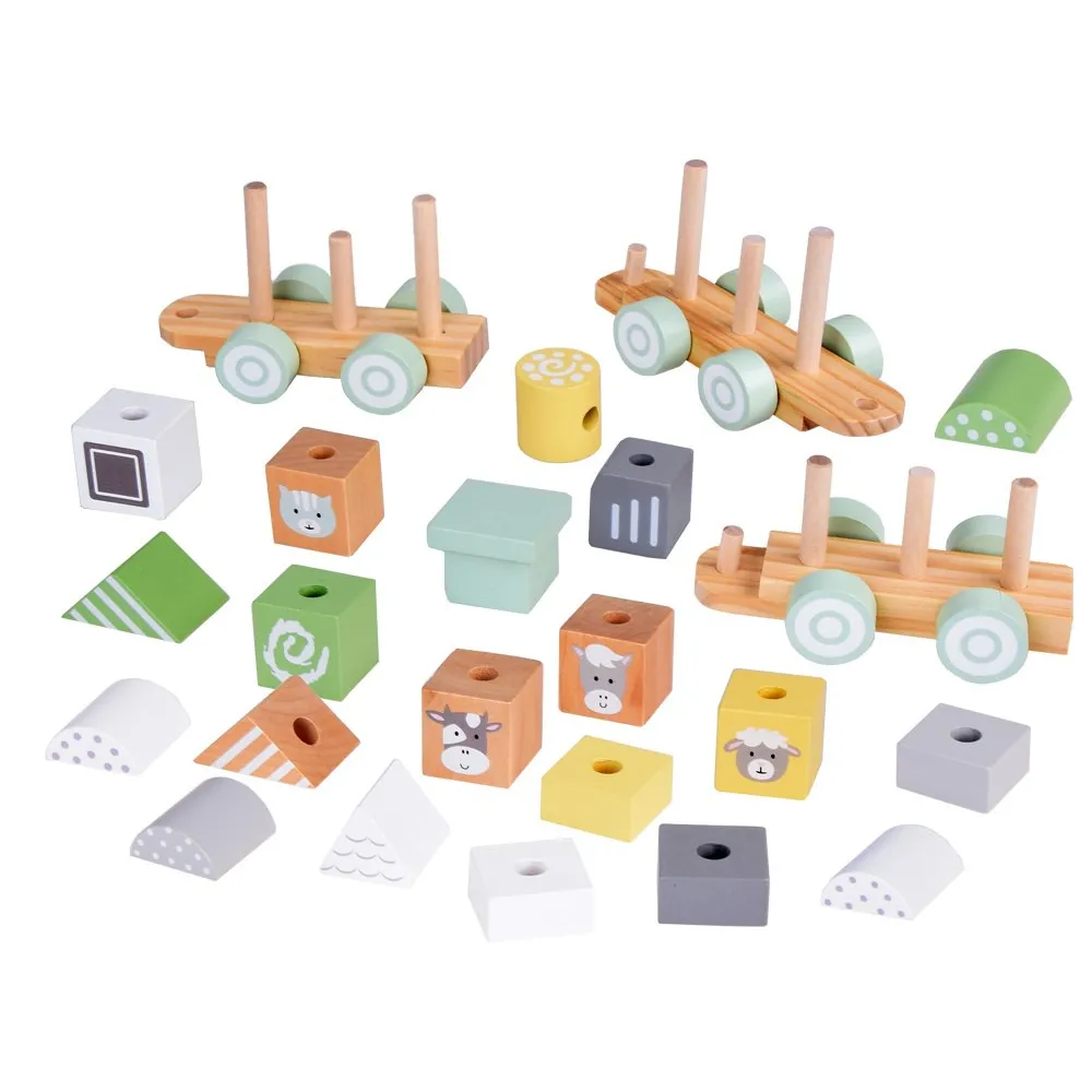 dwa wagoniki z kolorowymi klockami w różnych kształtach