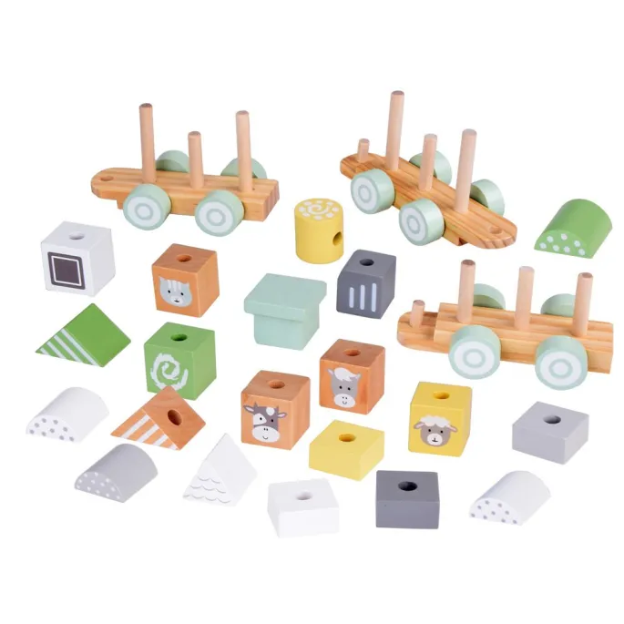 dwa wagoniki z kolorowymi klockami w różnych kształtach