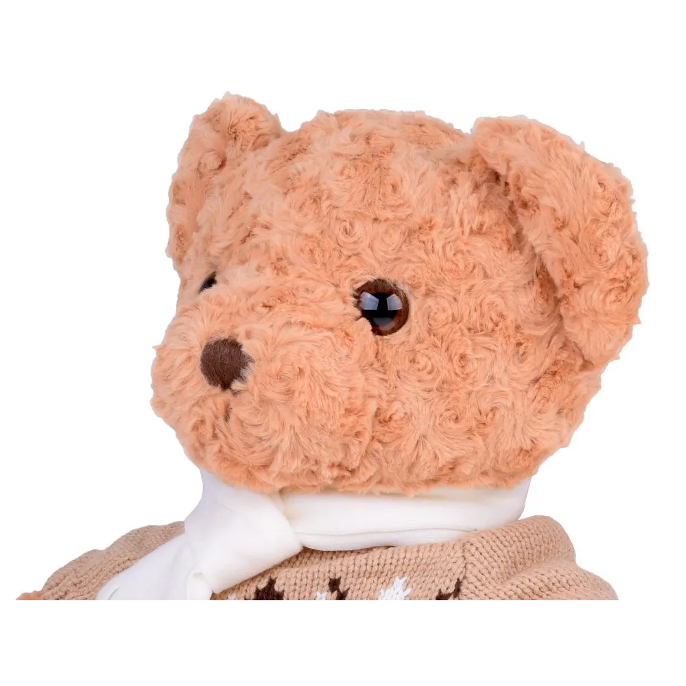 miś maskotka uchwycony w pozycji siedzącej na łóżku