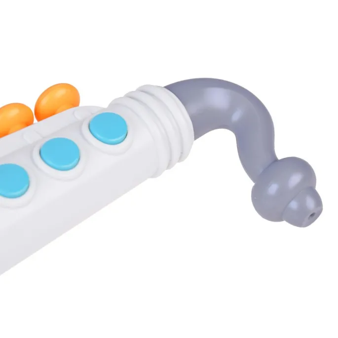 Detal ustnika i przycisków zabawkowego saksofonu