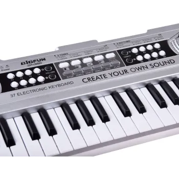 detal antypoślizgowej podstawy srebrnego keyboardu zabawkowego