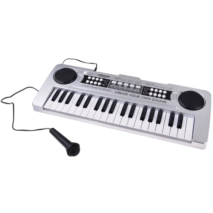 zestawienie akcesoriów: mikrofon, kabel usb i kabel aux in obok keyboardu