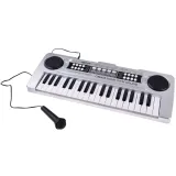 zestawienie akcesoriów: mikrofon, kabel usb i kabel aux in obok keyboardu