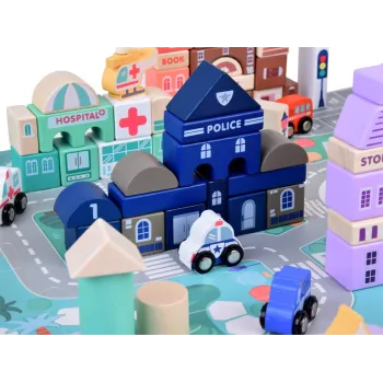 klocki o różnych kształtach budynków rozłożone na planszy