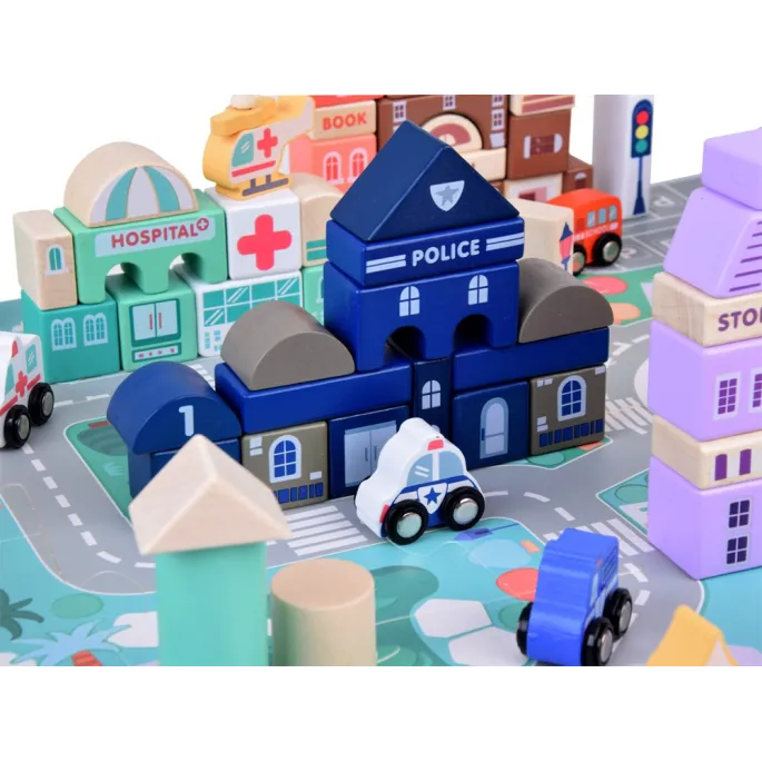 klocki o różnych kształtach budynków rozłożone na planszy