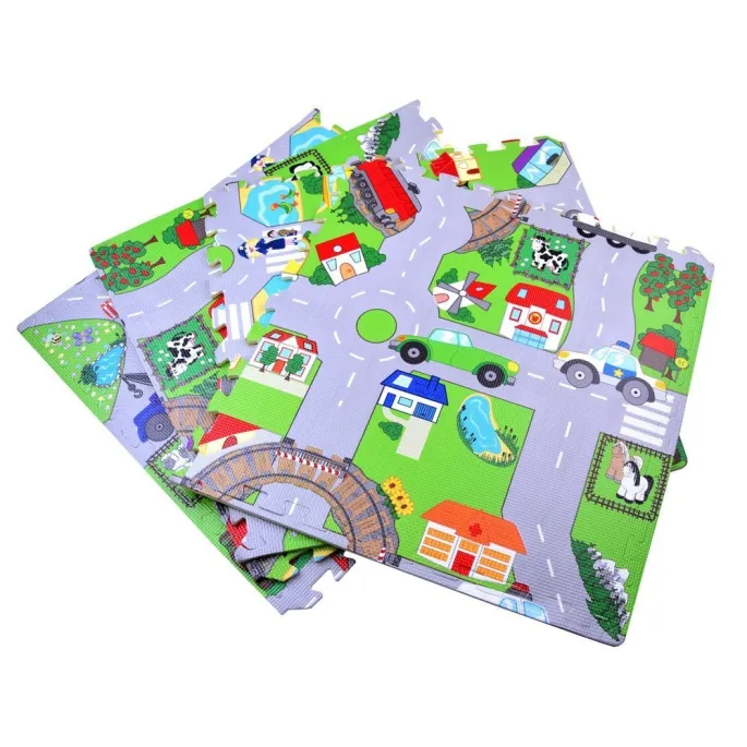 Duże elementy maty piankowej z motywem kolorowego miasteczka