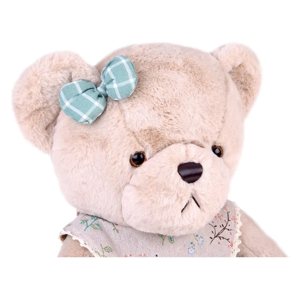 zbliżenie na beżowy pyszczek misia z brązowym nosem