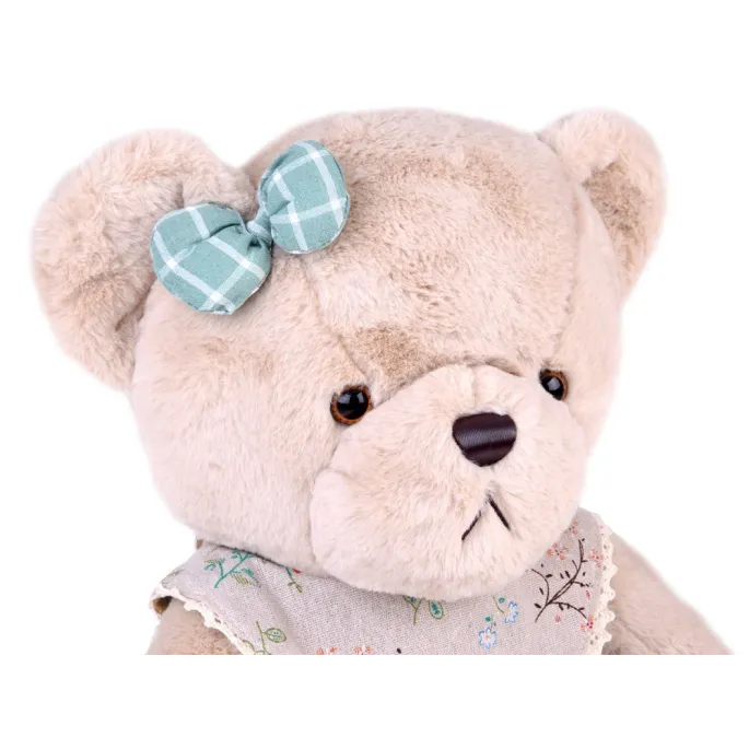 zbliżenie na beżowy pyszczek misia z brązowym nosem