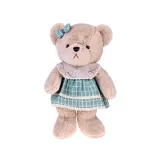 miś z zieloną kokardką w białą kratkę na głowie