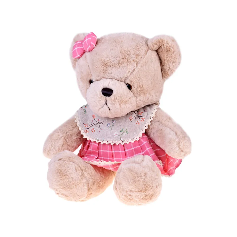 zbliżenie na beżową maskotkę z kokardką w kratkę na głowie