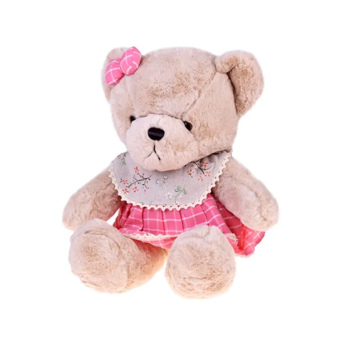 zbliżenie na beżową maskotkę z kokardką w kratkę na głowie