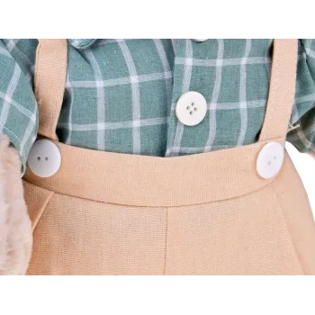 Detal ubranka z rzepami i ozdobnymi guziczkami pluszowego misia