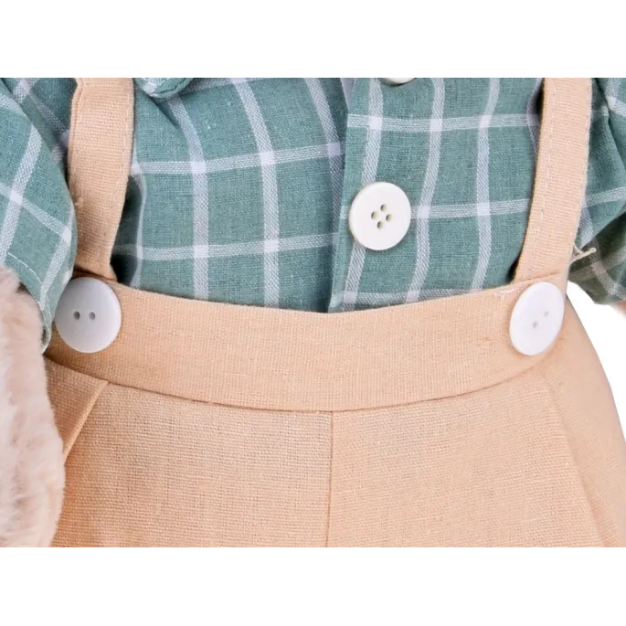 Detal ubranka z rzepami i ozdobnymi guziczkami pluszowego misia