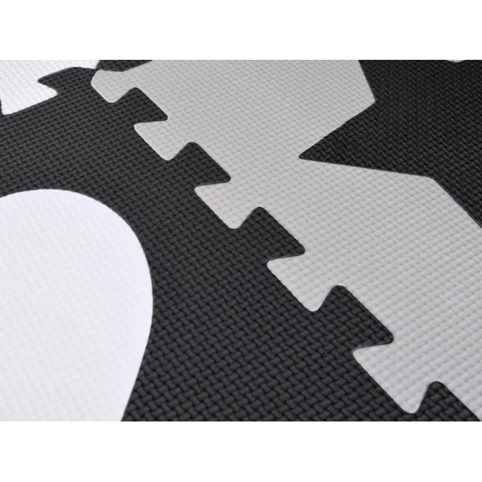 zbliżenie na stonowane kolory puzzli piankowych w grafitach i szarościach