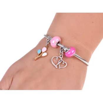 plastikowa pęseta oraz szpulka elastycznej żyłki w szkatułce