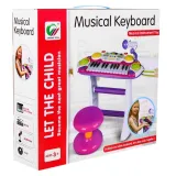Opakowanie zestawu muzycznego dla dzieci z widoczną grafiką keyboardu