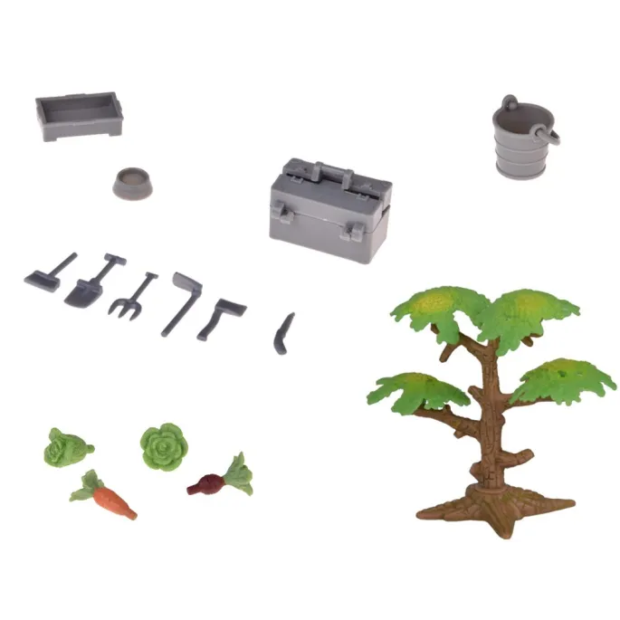 Figurki rolników dbających o zwierzęta gospodarskie na farmie zabawkowej