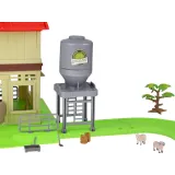 Zestaw podczas zabawy z ułożonym torem wokół budynków farmy