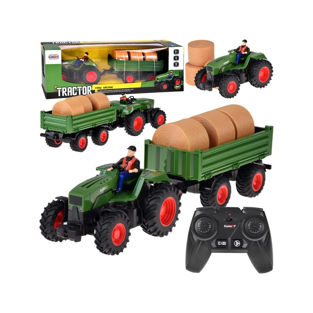 Traktor na pilota z przyczepą i balami siana na białym tle