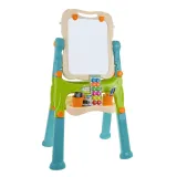 tablica ustawiona na krótkich nogach z taboretem obok