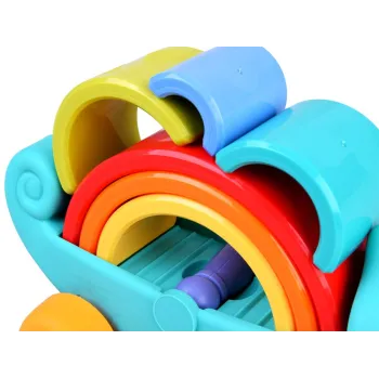 fioletowy wałeczek obok intensywnie kolorowych elementów układanki